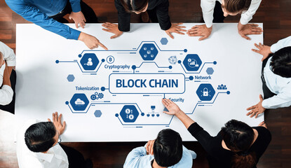 A diverse team gathered around a table discussing key concepts in blockchain technology including security, tokenization, and cryptography within a corporate environment. Amity