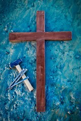 Cross Hammer & Nails on Blue Mud of Sin