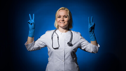 female doctor from the dark shows peace sign