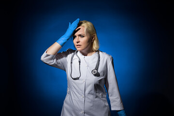 the female doctor put her hand to her forehead. concept of what i did