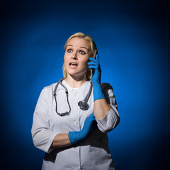 female doctor talking on the phone received shocking news. concept yes what are you talking about?