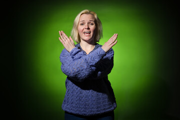 no war showing sign woman in blue on green background
