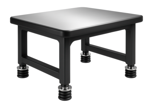 Ergonomic anti-vibration table with a curved design and air spring isolators for use in medical device manufacturing.