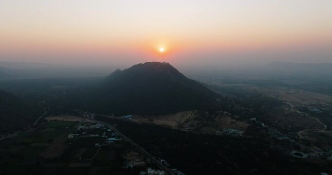 Aerial view of sunset over mountains and valley, India.