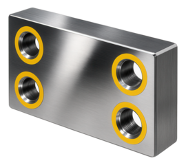 Rectangular steel balancing weights with bolt holes for CNC lathes in a manufacturing facility