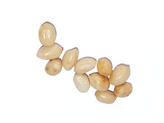 Peeled dried peanuts isolated on white background. Group of peanuts. Fresh peanuts.