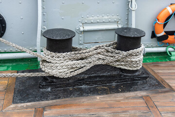 Rope on bollards on board a ship.