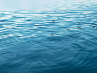 abstract ripples in calm water, soft blue gradients, peaceful mood