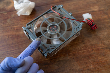 Dust on the computer fan.Cleaning the cooling system.