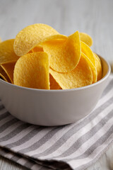 Potato Chips in a Bowl, side view. Close-up.