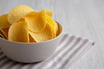 Potato Chips in a Bowl, side view. Copy space.