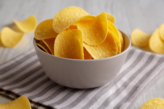 Potato Chips in a Bowl, side view. Close-up.