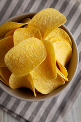 Potato Chips in a Bowl, top view. Flat lay, overhead, from above.