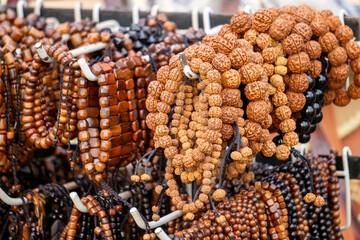 Various types and models of beaded bracelets are arranged on display.