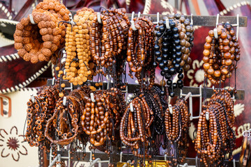 Various types and models of beaded bracelets are arranged on display.