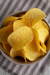 Potato Chips in a Bowl, top view. Flat lay, overhead, from above.