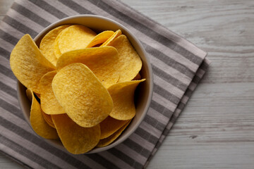 Potato Chips in a Bowl, top view. Flat lay, overhead, from above.