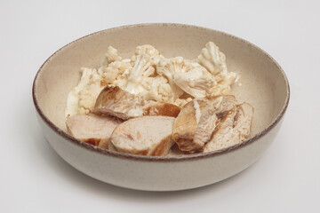 chicken breast with cauliflower in a plate