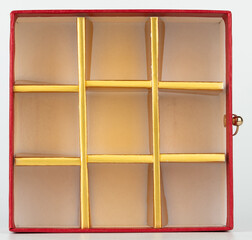 Colorful red box with yellow dividers designed for organizing items neatly