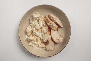 chicken breast with cauliflower in a plate