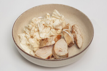 chicken breast with cauliflower in a plate