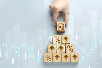 Increase in real estate value. Woman putting cube with house icon to others on grey background, top...