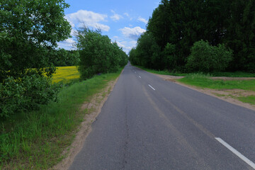 Highway wide road, transport and blue sky with clouds on a summer day