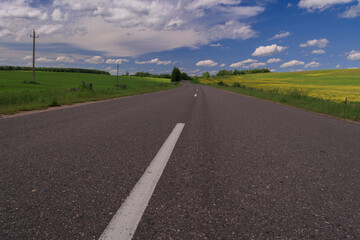 Highway wide road, transport and blue sky with clouds on a summer day