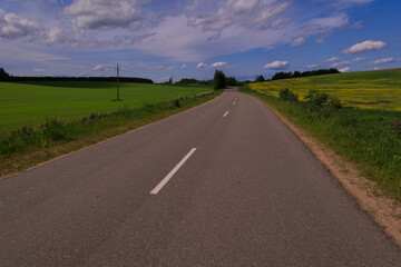 Highway wide road, transport and blue sky with clouds on a summer day