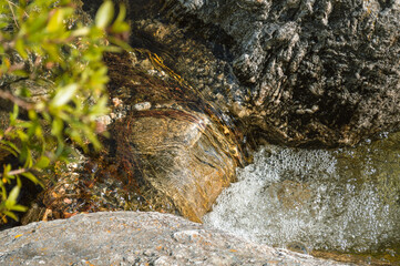 close-up of a mini waterfall in a stream