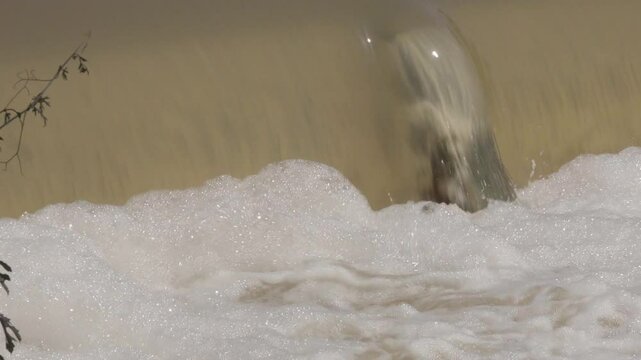 Texas 2025 flood water being released and flowing over downstream small dam