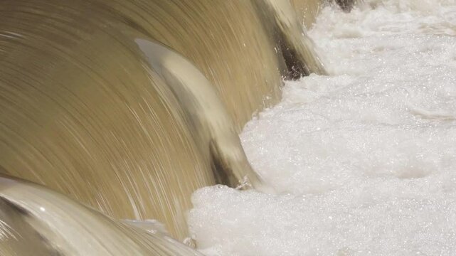 Texas 2025 flood water running over small dam