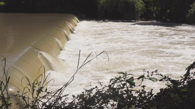 Texas 2025 flood water being released from large flood control dam and flowing over small dam downstream