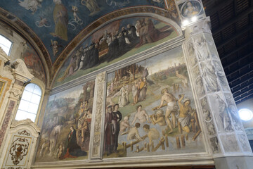 Fresco of the diversion of the Serchio River with nude workers, saints, and city background, by...