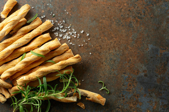Homemade grissini breadsticks with sea salt and rosemary.