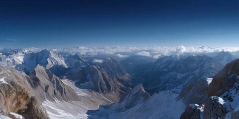 Majestic snow-capped mountain peaks under clear blue sky
