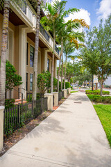 Sidewalk Miami Lakes Florida. View of mixed use residential and commercial business buildings on Main Street 2025