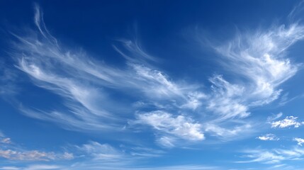 Obraz premium Light blue sky with thin, delicate clouds