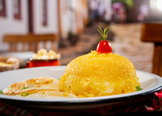 couscous sttufed with cheese with eggs in a beautiful countryside city setting ( cuzcuz )