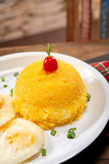 couscous sttufed with cheese with eggs in a beautiful countryside city setting ( cuzcuz )