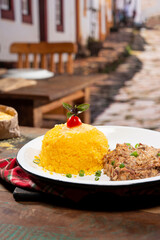 couscous with dried meat  in a beautiful countryside city setting ( cuzcuz )
