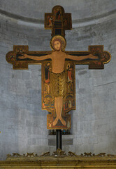 Painted wooden crucifix with Christus Triumphans iconography, San Michele in Foro, Lucca, Italy, medieval Tuscan style.