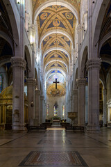 Interior of San Martino Cathedral in Lucca, Italy, with pointed arches, painted vaulted ceilings,...