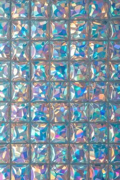 Elegant iridescent texture of glass mosaic tiles with soft pastel reflections. Elegant, minimalistic and laconic background for creative projects and digital art.