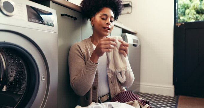Laundry, smell and cleaning with woman and washing machine for fabric, hygiene and linen. Clothes, housekeeping and scent with person in washroom of home for cleaner, dryer and domestic chores