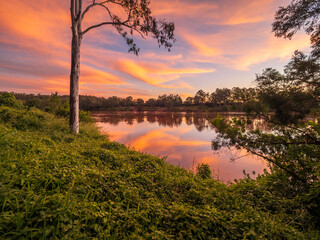 Beautiful Sunset Over The River with Cloud Reflections