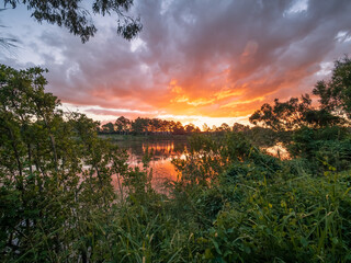 Beautiful Sunset Over The River with Cloud Reflections