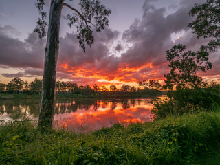 Beautiful Sunset Over The River with Cloud Reflections