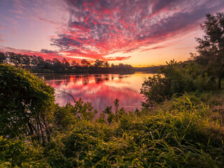 Beautiful Sunset Over The River with Cloud Reflections