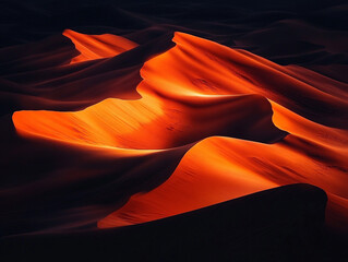 A mesmerizing view of desert dunes glowing with golden-orange sunlight, creating dramatic shadows and flowing shapes. A powerful yet minimalist natural scene.

